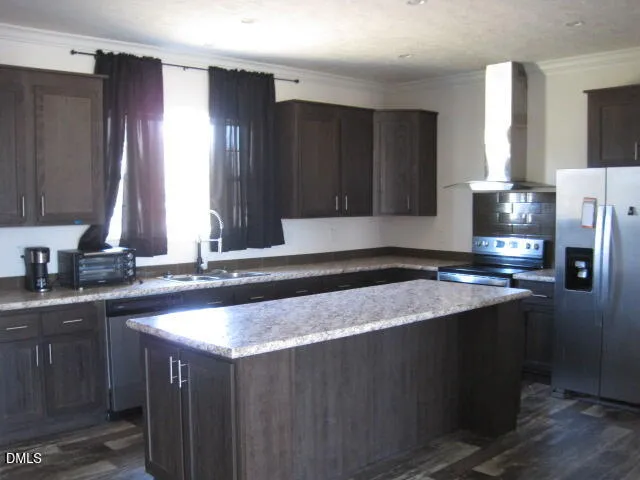a kitchen with a sink a stove and cabinets