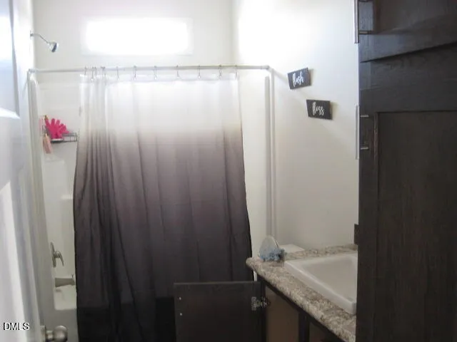 a living room with a flat screen tv and a fireplace