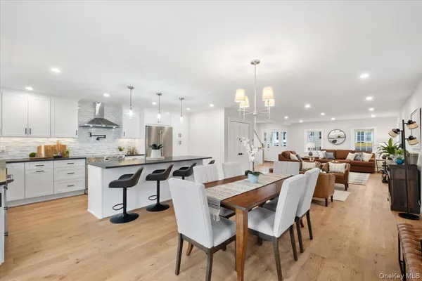 a kitchen with stainless steel appliances kitchen island granite countertop a sink and cabinets
