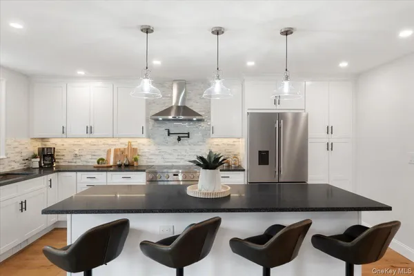 a kitchen with a counter space cabinets and stainless steel appliances