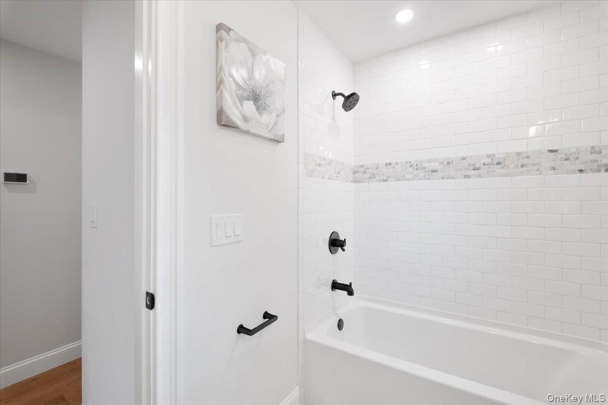 32 Ackerman Street Beacon, NY 12508 - Photo 26 of 50 a bathroom with a bathtub and shower