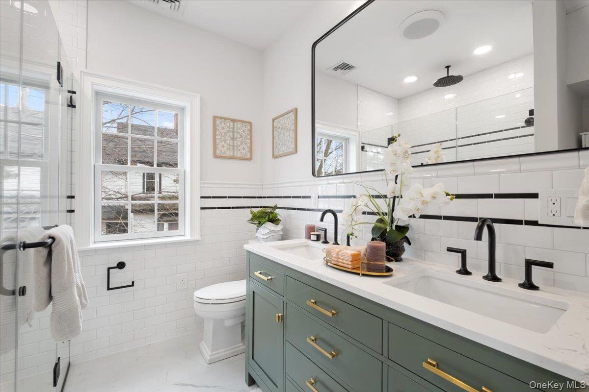 32 Ackerman Street Beacon, NY 12508 - Photo 30 of 50 a bathroom with a sink a toilet and shower