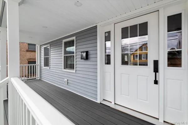 a living room with furniture kitchen view and a table