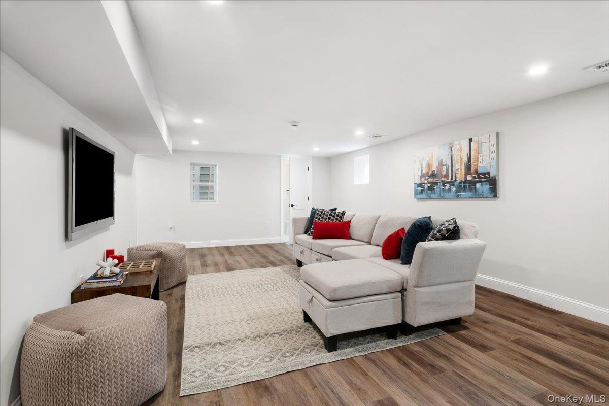 32 Ackerman Street Beacon, NY 12508 - Photo 37 of 50 a living room with furniture and a flat screen tv