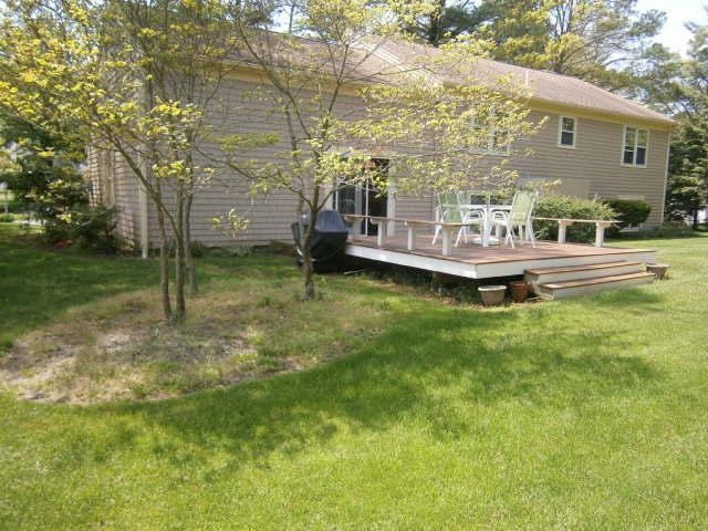 298 Nye Road Centerville, MA 02632 - Photo 12 of 26 a view of a house with a yard balcony and sitting area