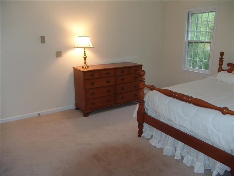 298 Nye Road Centerville, MA 02632 - Photo 16 of 26 a bed room with a bed and a window