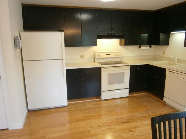 298 Nye Road Centerville, MA 02632 - Photo 3 of 26 a kitchen with a sink a stove and refrigerator