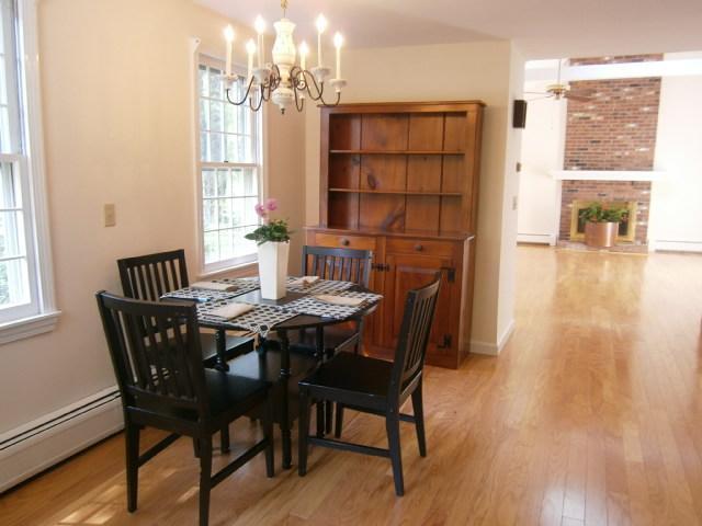 298 Nye Road Centerville, MA 02632 - Photo 4 of 26 a view of a dining room with furniture and wooden floor