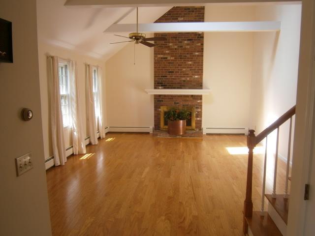 298 Nye Road Centerville, MA 02632 - Photo 7 of 26 wooden floor in an empty room with a window