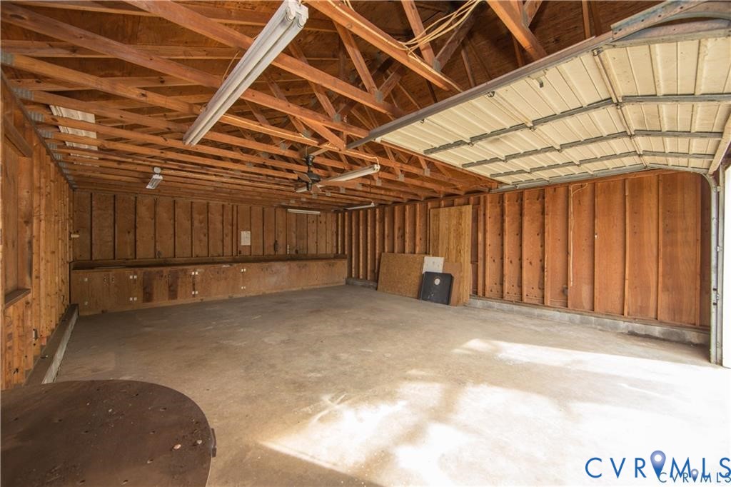 3940 Three Bridge Road Powhatan, VA 23139 - Photo 4 of 4 Spacious garage with exposed wood beam ceiling, co