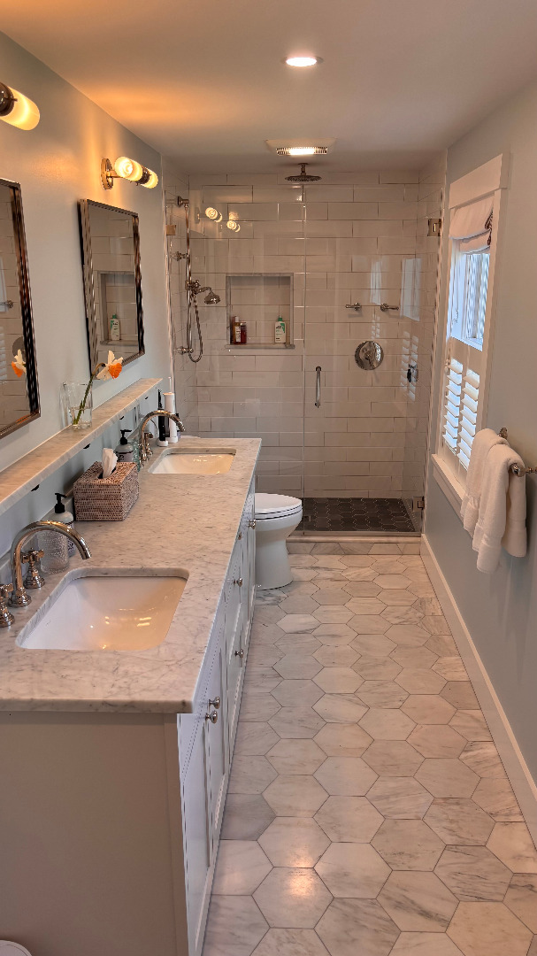 31 North Street Edgartown, MA 02539 - Photo 37 of 49 a bathroom with a granite countertop sink a toilet a mirror and shower
