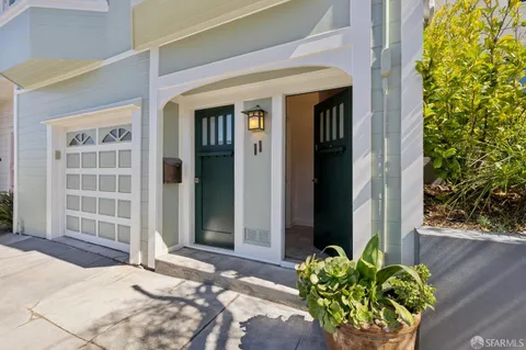 a view of a backyard with table and chairs