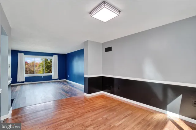 a kitchen with kitchen island a counter top space appliances and cabinets