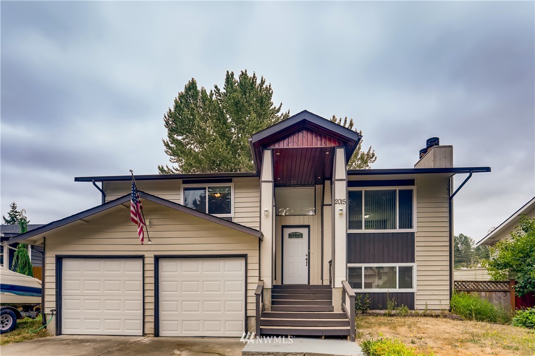 2015 181st Street Southeast Bothell, WA 98012 - Photo 1 of 20 a front view of a house with a yard