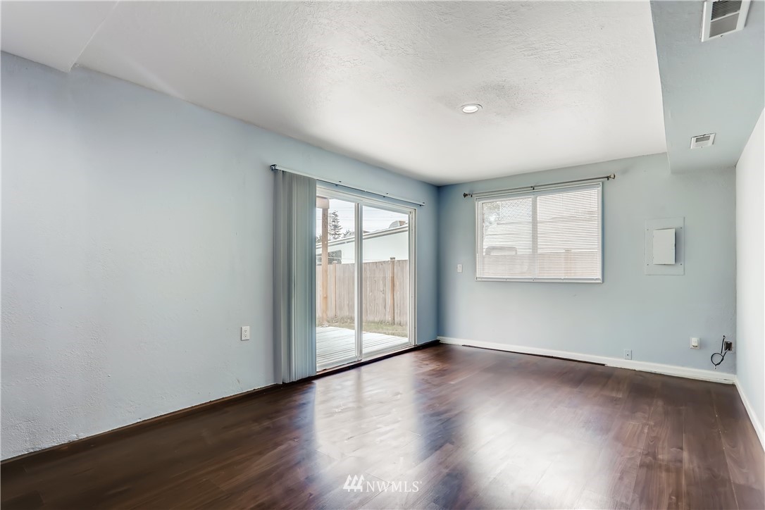 2015 181st Street Southeast Bothell, WA 98012 - Photo 13 of 20 an empty room with wooden floor and windows
