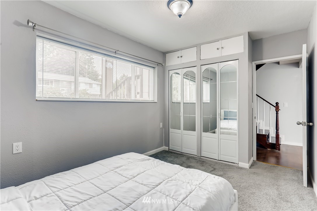 2015 181st Street Southeast Bothell, WA 98012 - Photo 15 of 20 a bedroom with a bed and a window