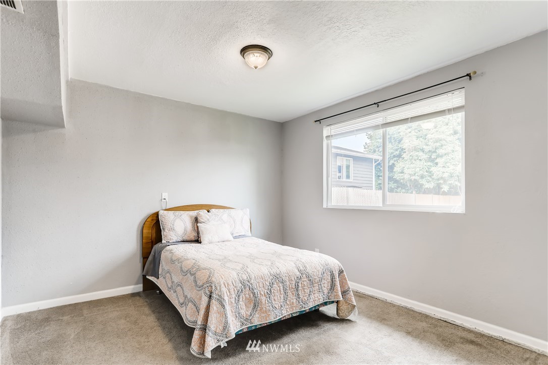 2015 181st Street Southeast Bothell, WA 98012 - Photo 16 of 20 a bedroom with a bed and window