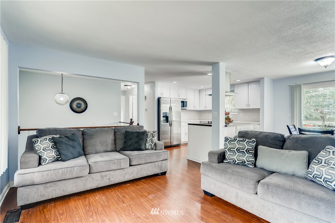 2015 181st Street Southeast Bothell, WA 98012 - Photo 6 of 20 a living room with furniture and a couch
