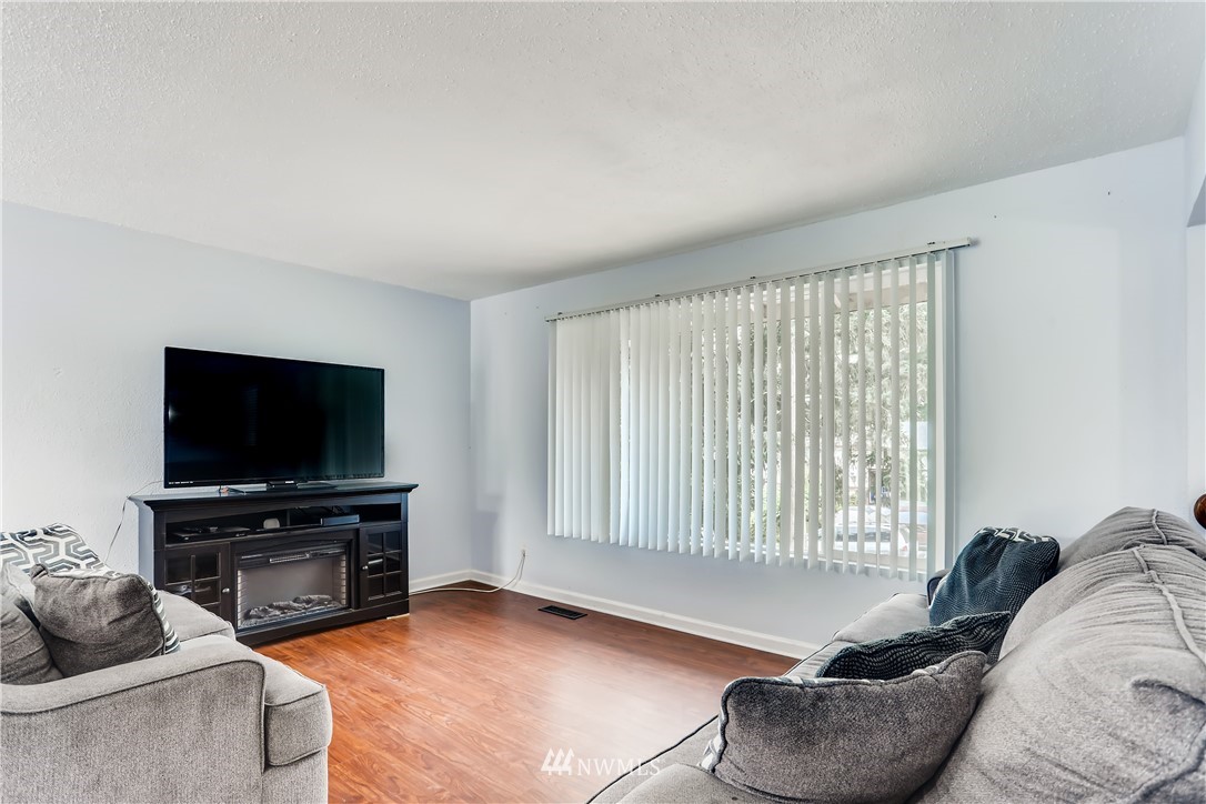 2015 181st Street Southeast Bothell, WA 98012 - Photo 7 of 20 a living room with furniture and a flat screen tv