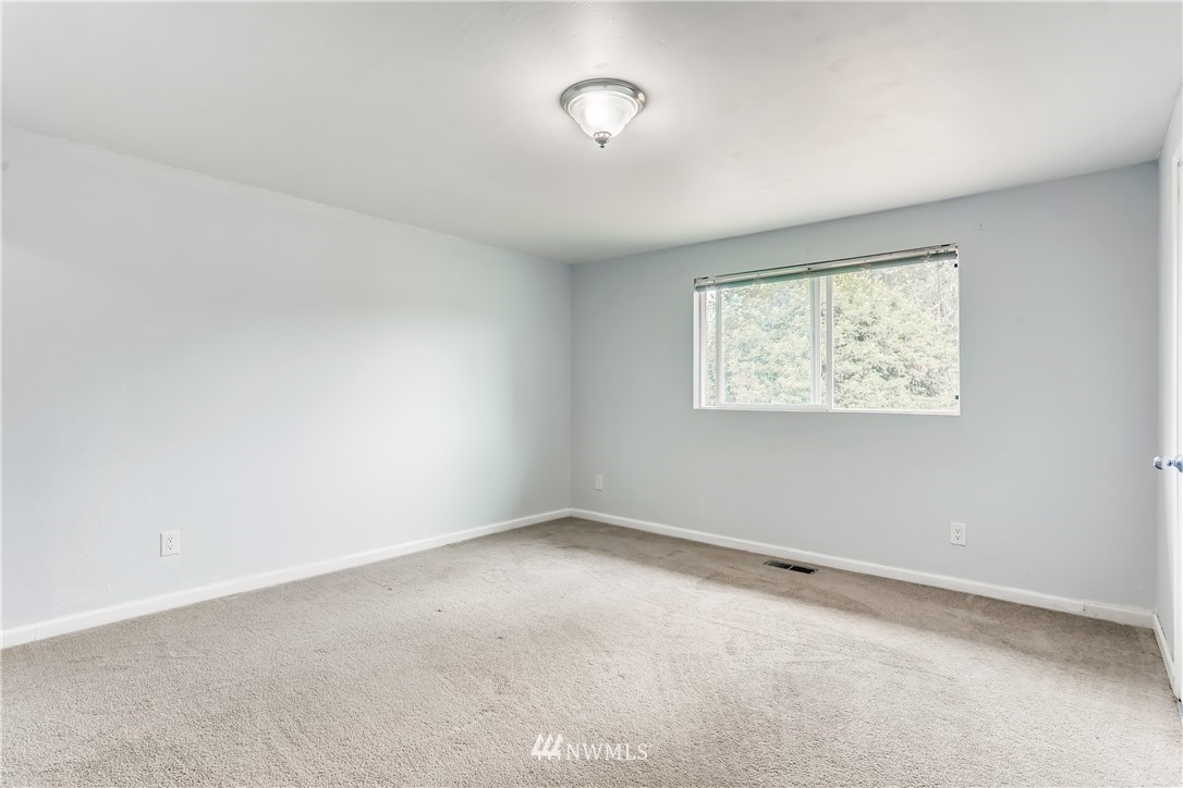 2015 181st Street Southeast Bothell, WA 98012 - Photo 8 of 20 an empty room with a window