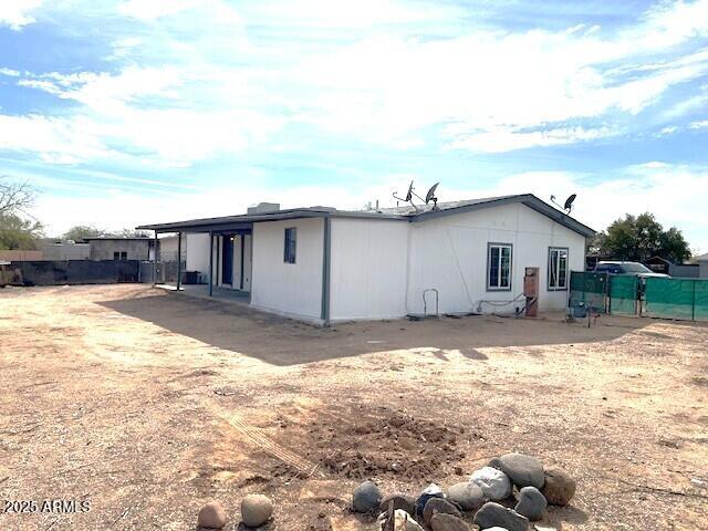 2853 East Marco Polo Road Phoenix, AZ 85050 - Photo 9 of 25 a view of a backyard with a large tree