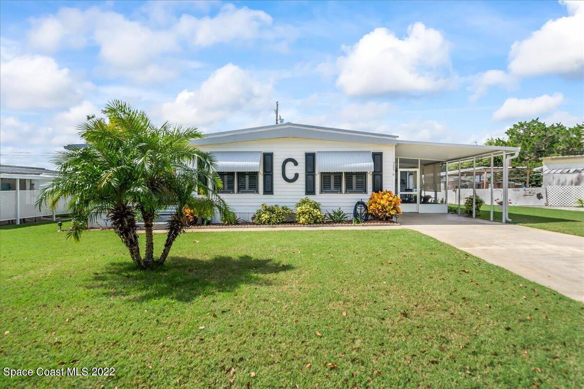 3256 Nancy Avenue Mims, FL 32754 - Photo 1 of 36 a front view of house with yard