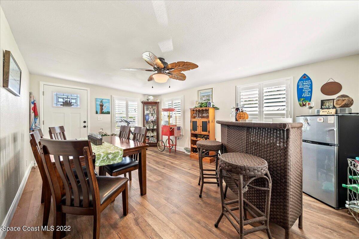 3256 Nancy Avenue Mims, FL 32754 - Photo 11 of 36 a view of a dining room with furniture and wooden floor