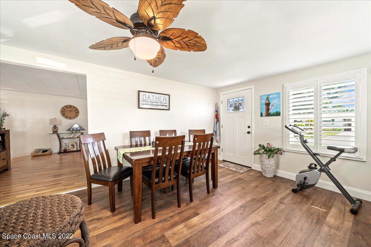 3256 Nancy Avenue Mims, FL 32754 - Photo 12 of 36 a view of a dining room with furniture and wooden floor