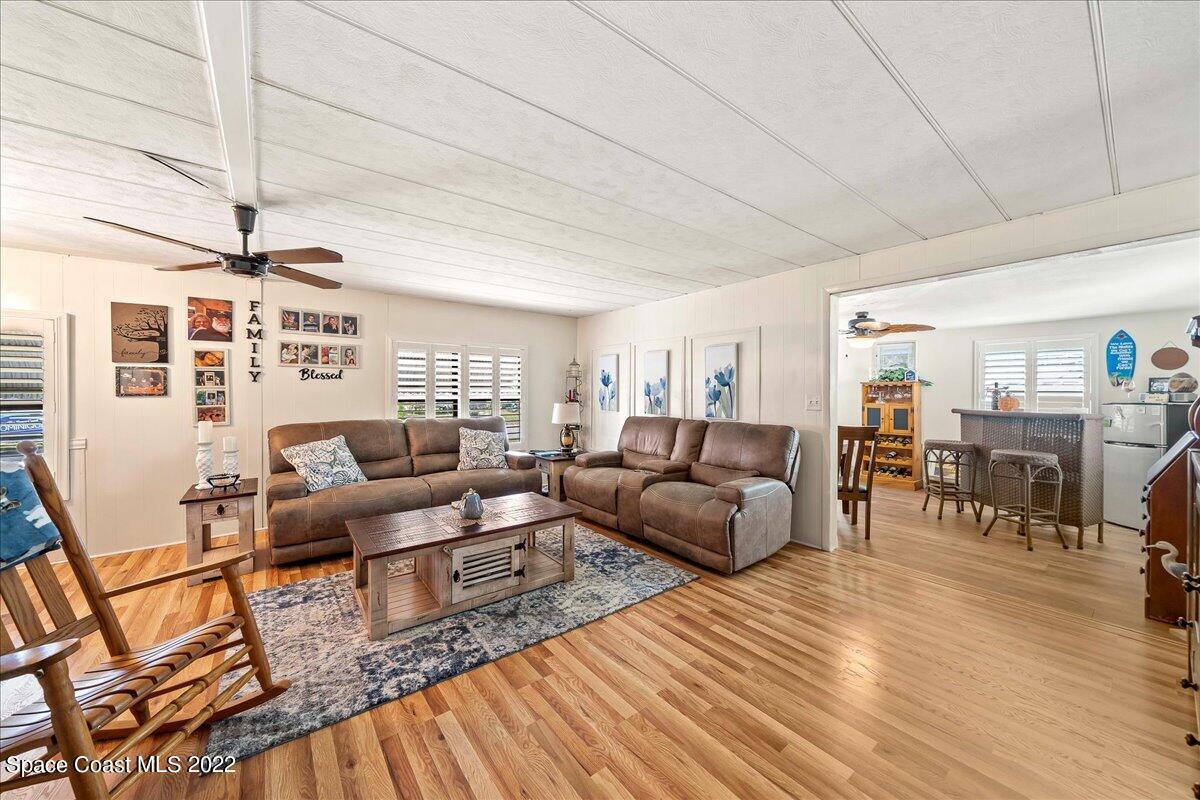 3256 Nancy Avenue Mims, FL 32754 - Photo 13 of 36 a living room with furniture and wooden floor