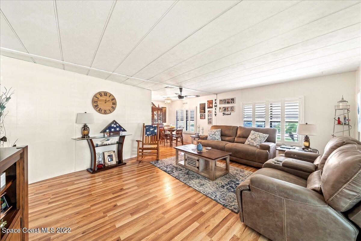 3256 Nancy Avenue Mims, FL 32754 - Photo 14 of 36 a living room with furniture and a large window