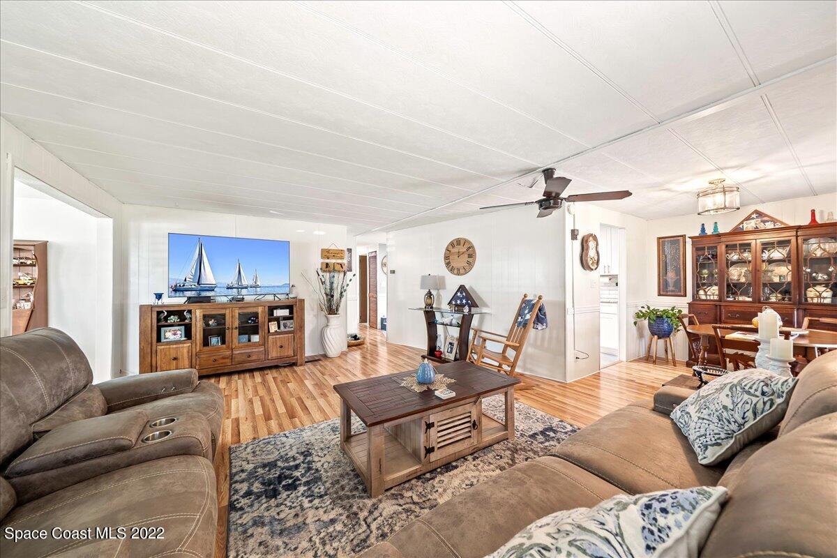 3256 Nancy Avenue Mims, FL 32754 - Photo 16 of 36 a living room with furniture and a large window