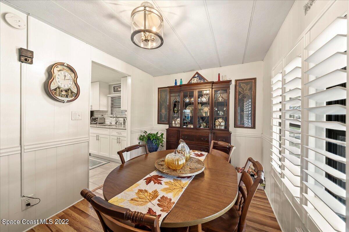 3256 Nancy Avenue Mims, FL 32754 - Photo 18 of 36 a view of a dining room with furniture window and wooden floor