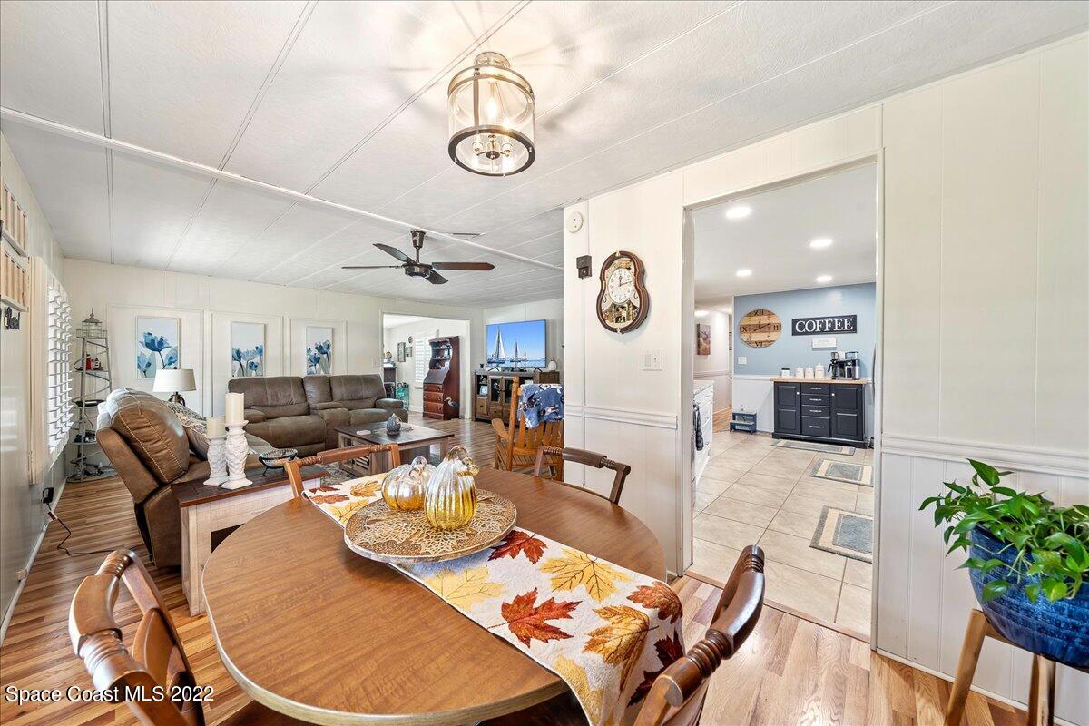 3256 Nancy Avenue Mims, FL 32754 - Photo 19 of 36 a living room with lots of furniture and kitchen view