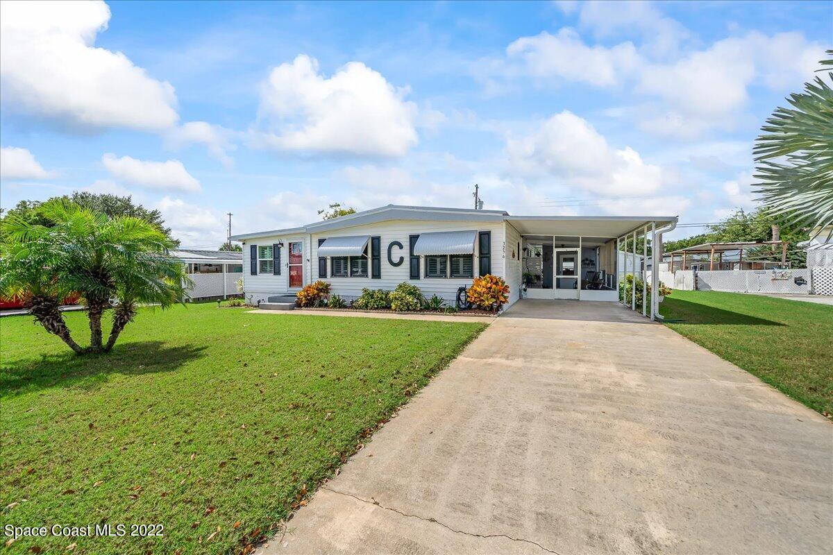 3256 Nancy Avenue Mims, FL 32754 - Photo 2 of 36 a view of house with outdoor space and porch