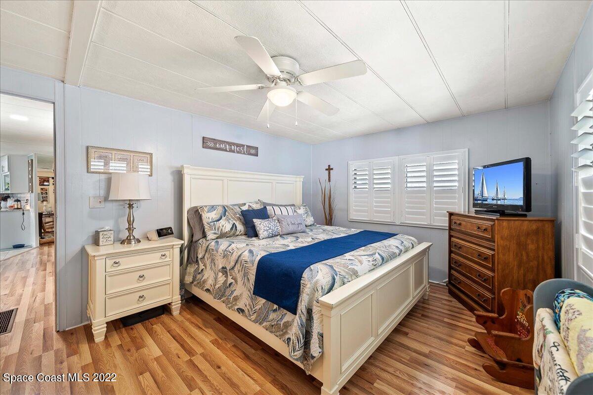 3256 Nancy Avenue Mims, FL 32754 - Photo 21 of 36 a bedroom with a bed and a couch