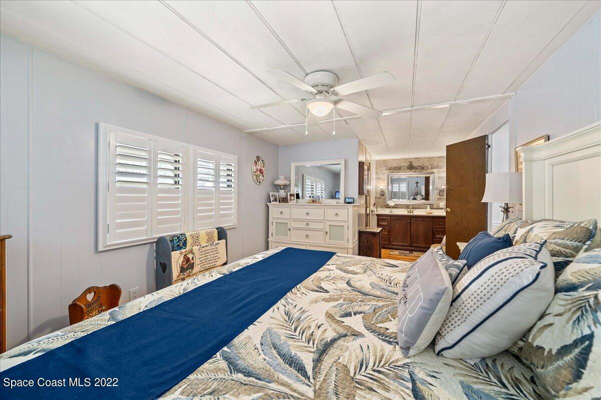 3256 Nancy Avenue Mims, FL 32754 - Photo 22 of 36 a bed room with a bed furniture and a large window