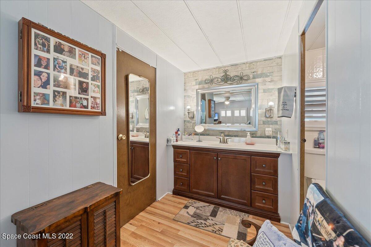 3256 Nancy Avenue Mims, FL 32754 - Photo 23 of 36 a spacious bathroom with a double vanity sink and a mirror