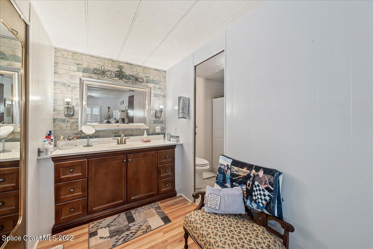 3256 Nancy Avenue Mims, FL 32754 - Photo 24 of 36 a bathroom with a sink and a mirror
