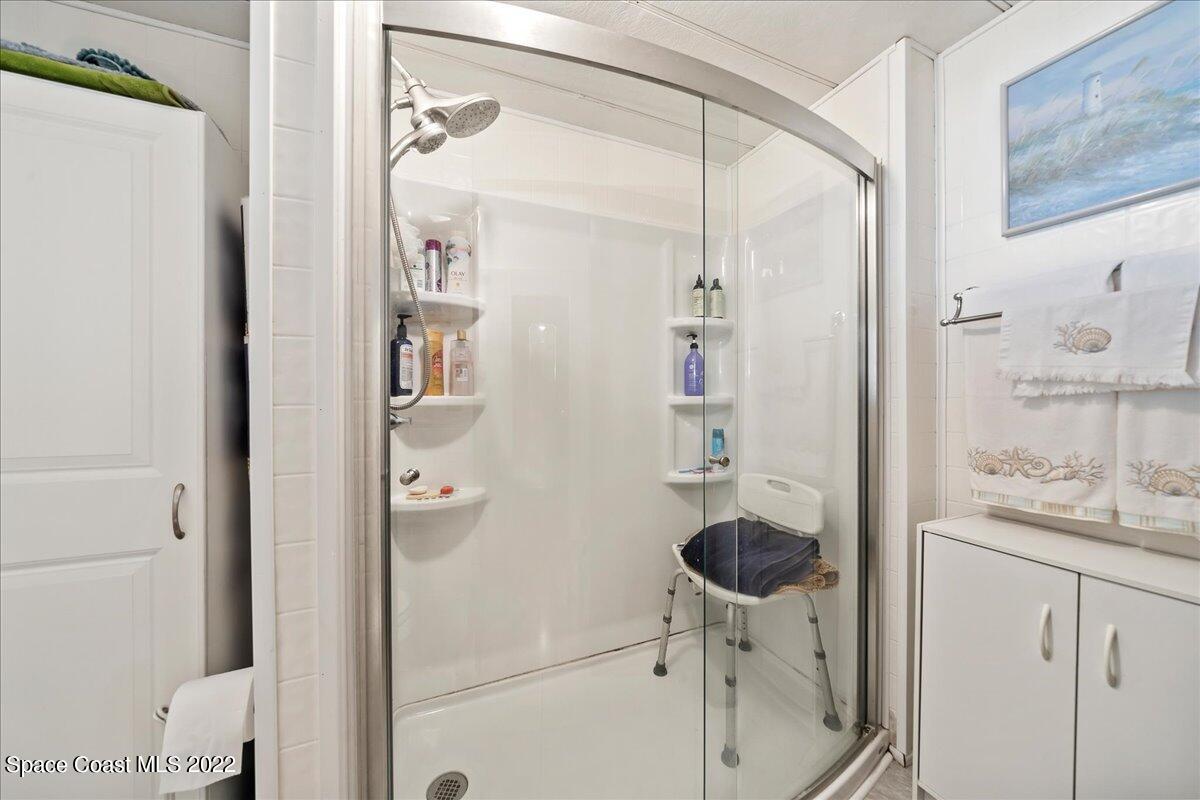 3256 Nancy Avenue Mims, FL 32754 - Photo 25 of 36 a bathroom with a sink and a mirror