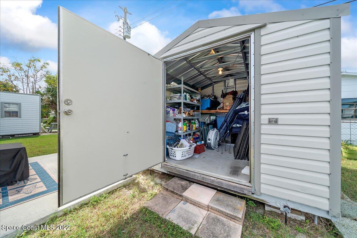 3256 Nancy Avenue Mims, FL 32754 - Photo 31 of 36 a view of a storage room with a lot of stuff
