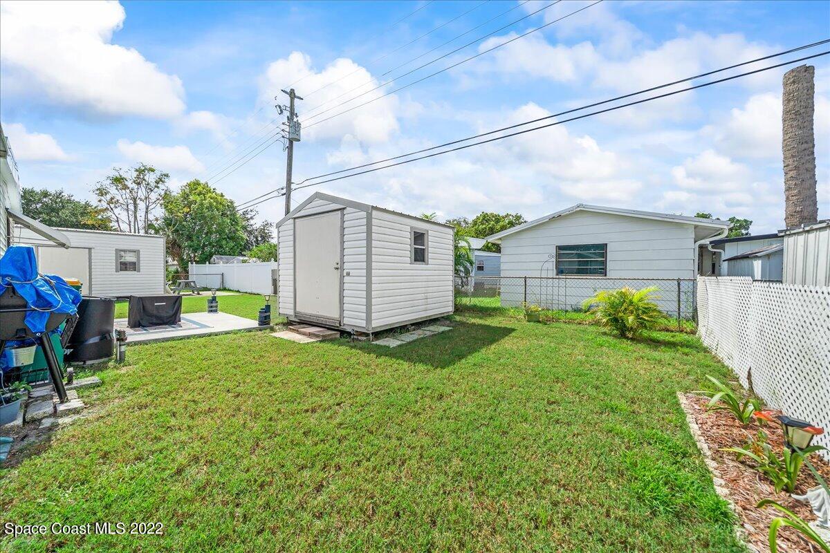 3256 Nancy Avenue Mims, FL 32754 - Photo 34 of 36 a view of a house with backyard