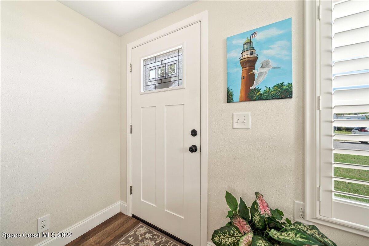 3256 Nancy Avenue Mims, FL 32754 - Photo 5 of 36 a view of an entryway with wooden floor