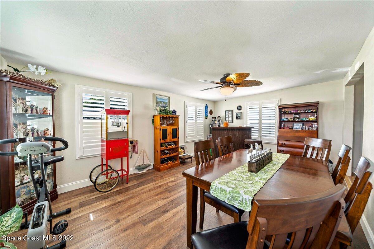 3256 Nancy Avenue Mims, FL 32754 - Photo 10 of 36 a view of a dining room with furniture and wooden floor