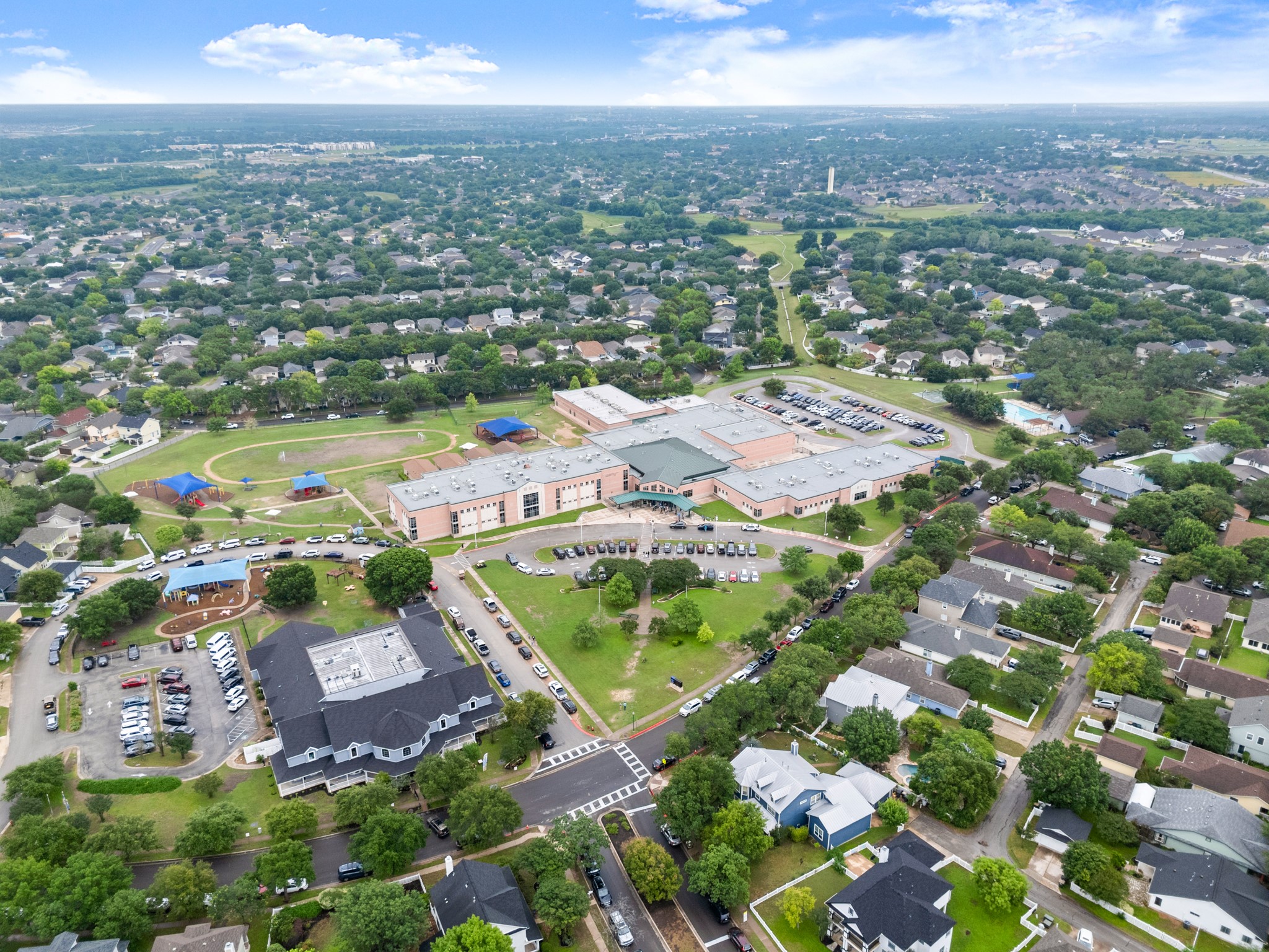 360 Sampson Kyle, TX 78640 - Photo 35 of 36 Expansive aerial view showcasing a residential area with mature tree coverage