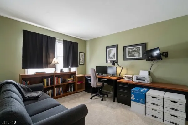 a reading room with furniture and a window