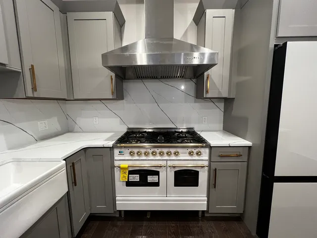 a kitchen with a stove and a sink