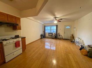 1242 Myrtle Avenue Brooklyn, NY 11221 - Photo 2 of 6 a view of a kitchen with a stove cabinets and a ceiling fan