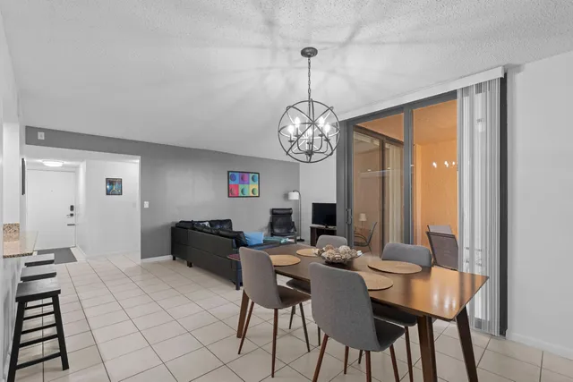 a dining room with a table and chairs