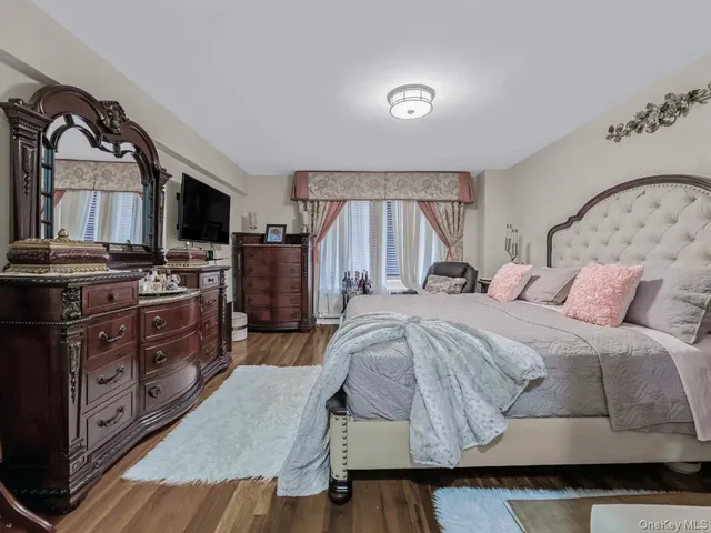 a bed room with a bed and a television