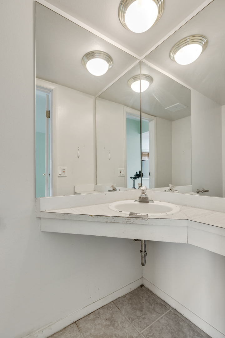 1790 Sessions Walk Hoffman Estates, IL 60169 - Photo 12 of 17 a bathroom with a sink and a mirror